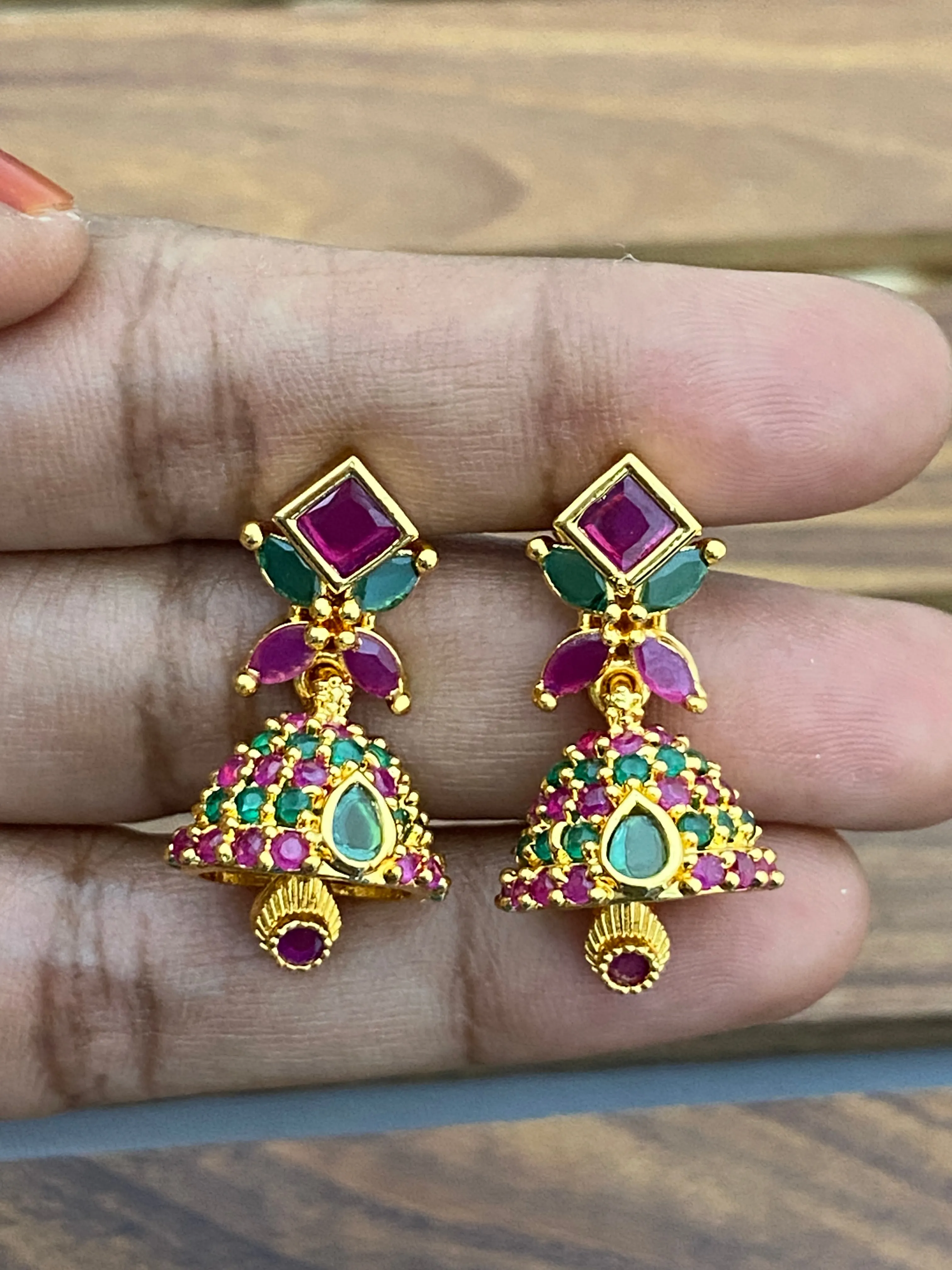 Stunning Gold Plated Ruby And Emerald Traditional Wear Jhumka Earrings For Wedding